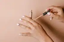 person holding white cigarette stick